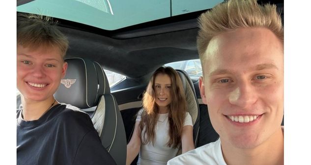 Oleksandr Orlovskyi with his brother and his girlfriend